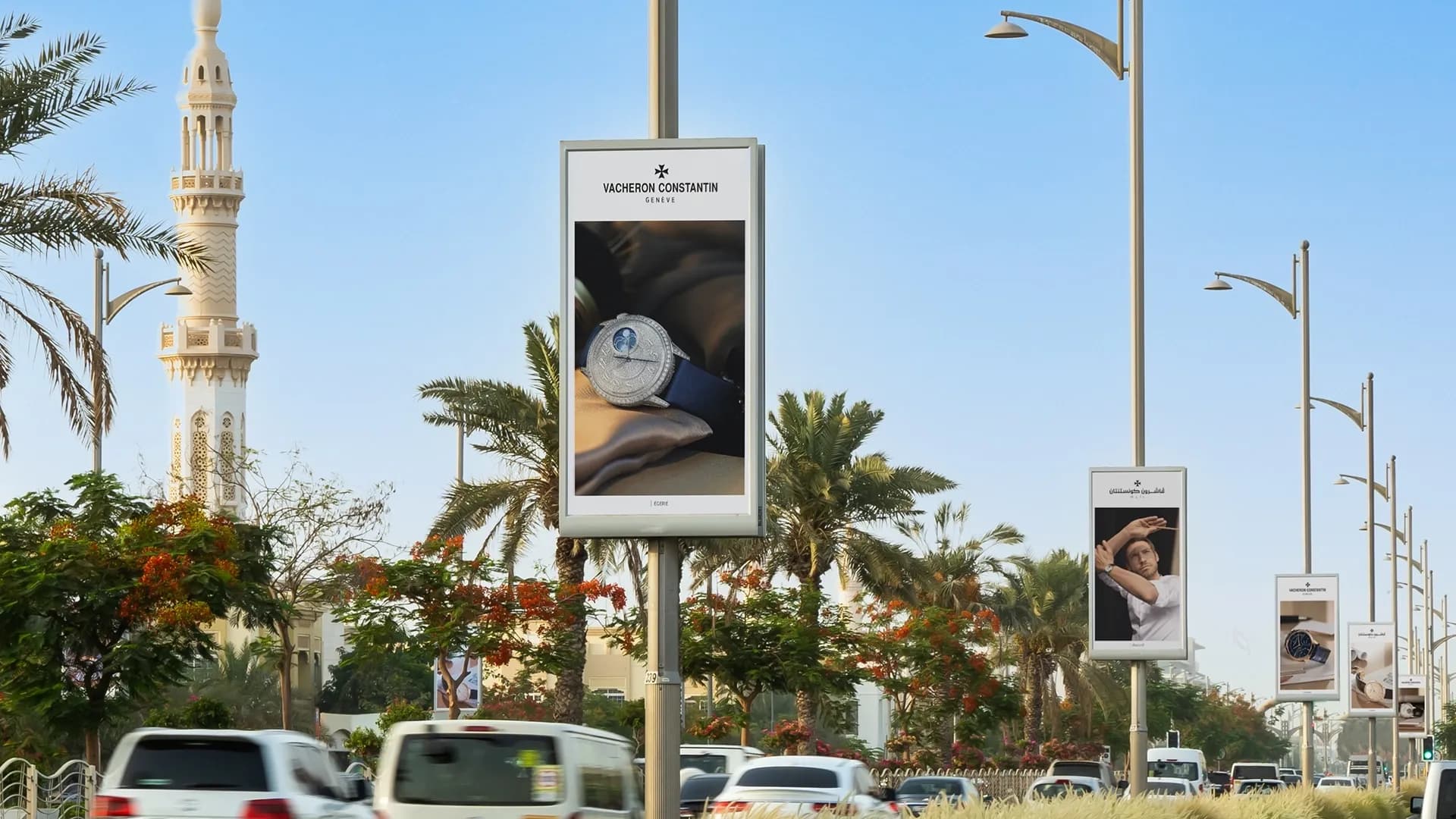 Lamppost banner advertising on a Dubai street, street-level OOH for local reach
