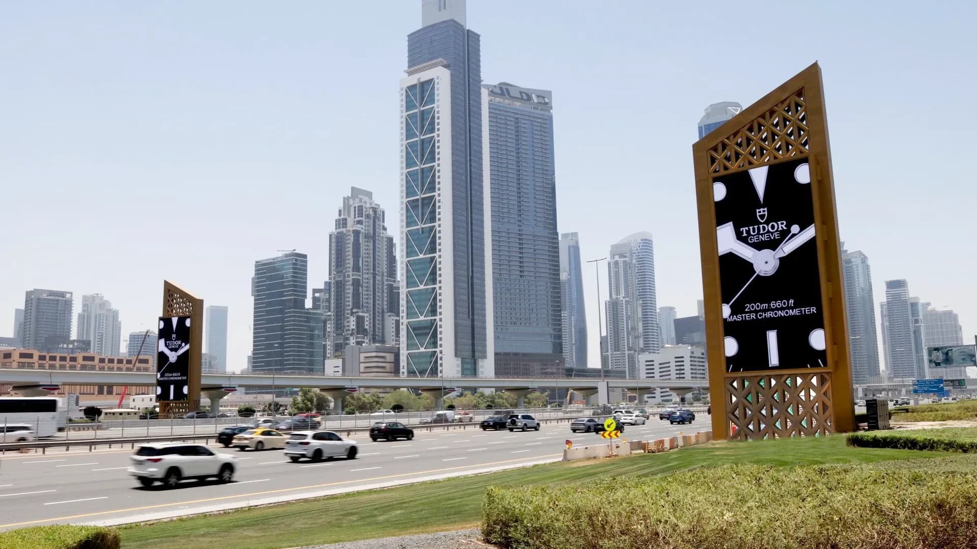 Static roadside billboard on a busy highway in Dubai, mass-reach outdoor advertising