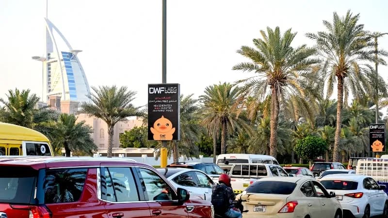 Lamppost banner advertising on Jumeirah Beach Road, Dubai, UAE