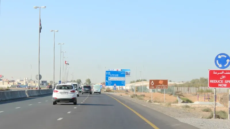 Outdoor roadside billboard advertising on Sheikh Mohammed Bin Salem Road, Ras Al Khaimah, UAE